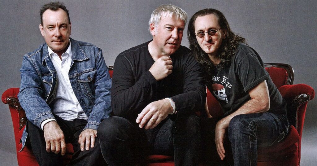 a group of men sitting on a couch