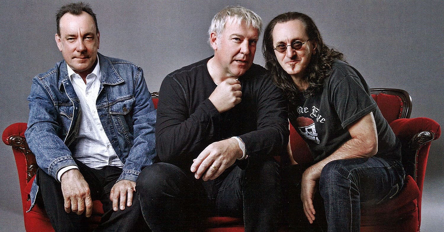 a group of men sitting on a couch